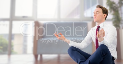 Businessman Meditating in office