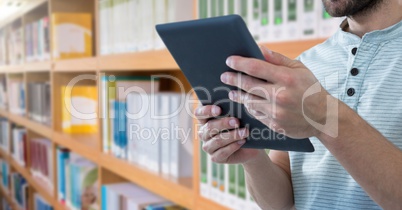 man on tablet in Library