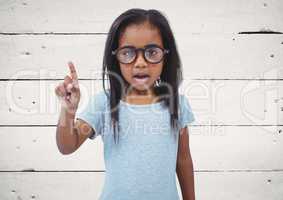 Girl with glasses against white wood panel