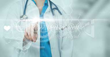 Doctor pointing at white graph with flare against blurry background with light blue overlay