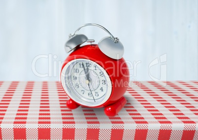Clock on red tablecloth