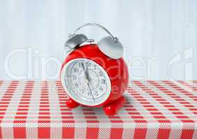 Clock on red tablecloth