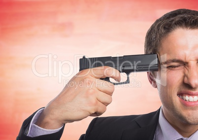 Business man with gun to head against blurry red wood panel