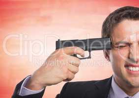 Business man with gun to head against blurry red wood panel