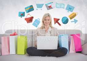 Woman on couch with shopping bags and online shopping graphic drawings