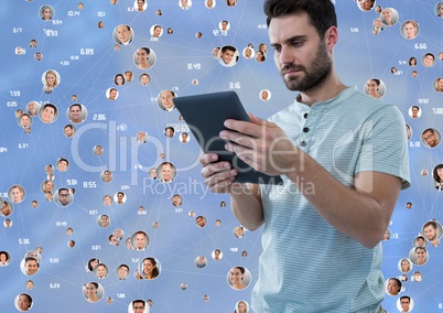 Man with tabler against Blurred background with connectors