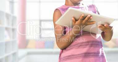 child on tablet in Library