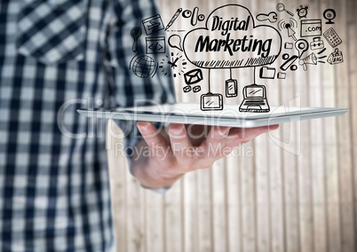 Man mid section with tablet and black digital marketing doodles against blurry wood panel