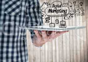 Man mid section with tablet and black digital marketing doodles against blurry wood panel