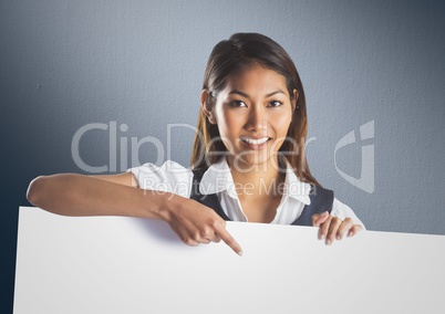 Business woman with large blank card against navy back