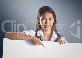 Business woman with large blank card against navy back