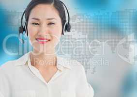 Travel agent with headset against map with blue background