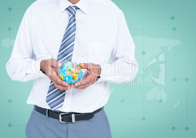 Travel agent mid section holding globe against green map