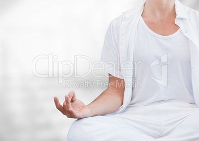 Womans hand Meditating with bright background