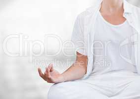 Womans hand Meditating with bright background