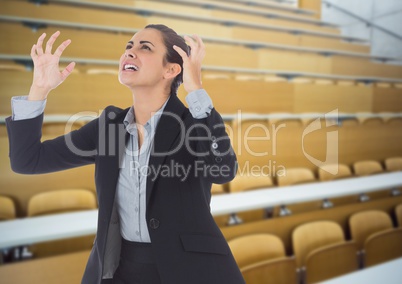 Stressed woman in lecture theatre classroom