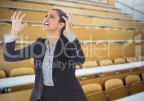 Stressed woman in lecture theatre classroom