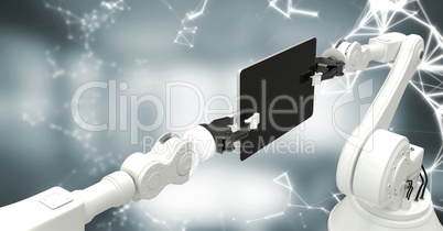 White robot claws with device and white interface against blurry grey room