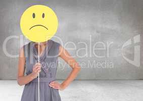 Sad woman holding face against grey background