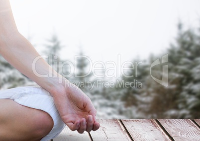 Woman Meditating in snow forest