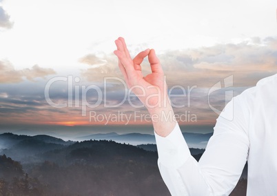 Man Meditating peacefully in mountains