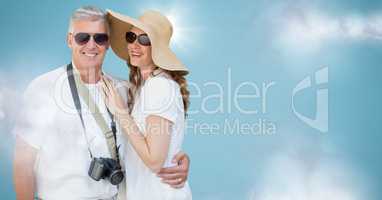 Couple summer clothes against blue background with clouds