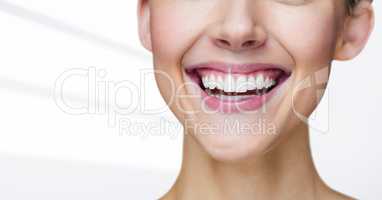 Close up of woman smiling against white background
