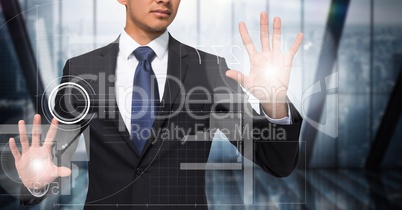 Business man with flares on hands touching white interface against dark blurry window