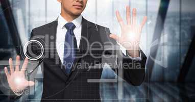 Business man with flares on hands touching white interface against dark blurry window