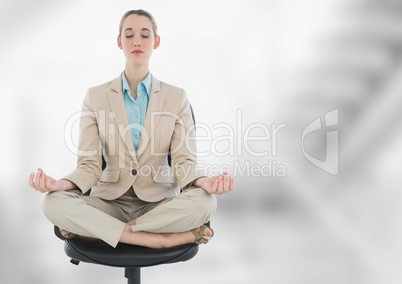 Businesswoman Meditating with bright background