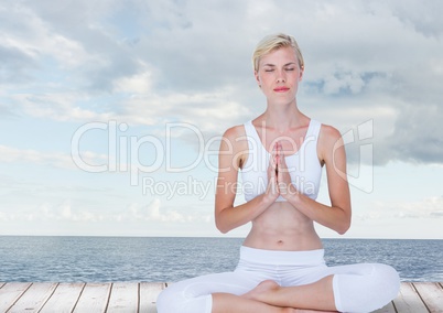 Woman Meditating by sea