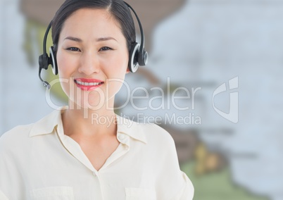Travel agent with headset against blurry map
