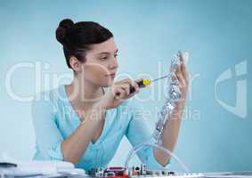 Woman with electronics against blue background