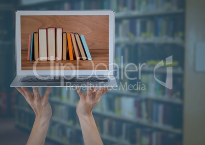 Hands with laptop showing book spines against blurry bookshelf with blue overlay