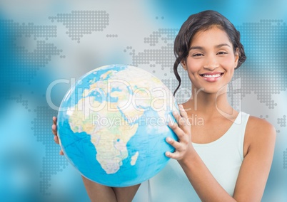 Woman with globe against blue map