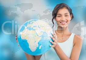 Woman with globe against blue map