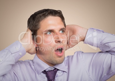 Close up of man inlavender shirt with hands on head against cream background