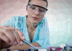 Woman with electronics against green and pink vector mesh