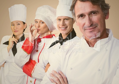 Four chefs against cream background