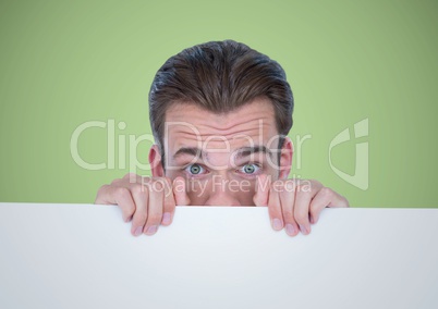 Man behind large blank card against green background