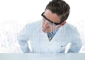 Man in lab coat leaning over table looking at white graph against white skyline