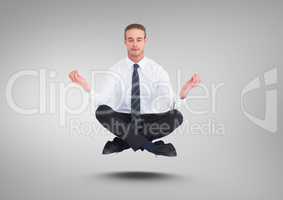 Businessman Meditating floating against grey background