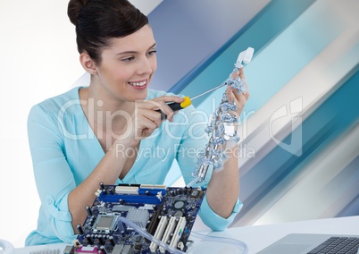 Woman with electronics against striped background