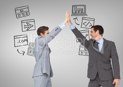 Businessmen high five with technology screens business graphics drawings