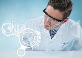 Man in lab coat leaning over table looking at white interface against blue background