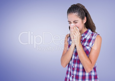 Girl blowing her nose in tissue with purple background