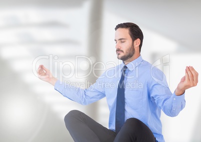 Businessman Meditating with bright background