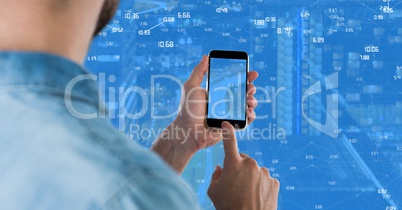 Man touching phone against Night city with connectors