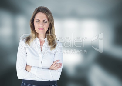 Upset stressed businesswoman against blurred background