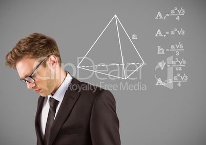 Businessman with equations drawing graphics